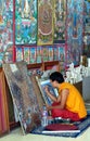 Close up of Tibetan Buddhist thangka being painted depicting Buddha Royalty Free Stock Photo