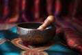 close-up of a tibetan singing bowl with a wooden mallet Royalty Free Stock Photo