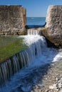 Close up of tide pool wall with waves of sea water - abstract creative background Royalty Free Stock Photo