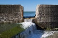 Close up of tide pool wall with waves of sea water - abstract creative background Royalty Free Stock Photo