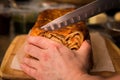 Close-up of timballo being cut with a chefs knife. Royalty Free Stock Photo