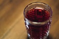 Close up tincture of red color in a crystal glass