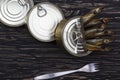 Close-up of Tinned capelin fish on wooden background Royalty Free Stock Photo