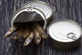 Close-up of Tinned capelin fish on wooden background Royalty Free Stock Photo