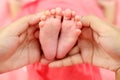 Close up of tiny feet of newborn baby