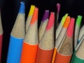 Close up of the tips of coloured pencils with a black background Royalty Free Stock Photo