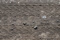 Close-up tire tracks truck on a dirt road in daylight