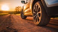 Close up tire and wheel of a car on the road in background. The driving concept of travel and vacation Royalty Free Stock Photo