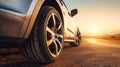 Close up tire and wheel of a car on the road in background. The driving concept of travel and vacation Royalty Free Stock Photo