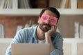 Close up tired businessman with stickers on eyes sleeping Royalty Free Stock Photo