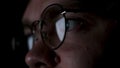 Close up of tired man putting off glasses and rubbing his eyes. Concept. The reflection of the screen in the glasses of Royalty Free Stock Photo