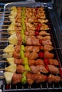 Close up to barbecue on skewers in grill stove.