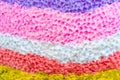 Close up to beautiful of various rough textures and colors of candles. Texture multicolor background.