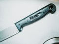 Close up to black knife handle with small water drop clean and p Royalty Free Stock Photo