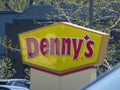 A close up to a Dennys fast food restaurant sign