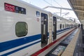 A close up to the doors of a colloquially known in English as the bullet train a