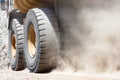 Close-up to the dust raised by a dump truck at a copper mine