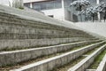 Close up to a Geometric pattern of a modern white street stairways with green grass