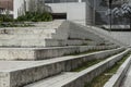 Close up to a Geometric pattern of a modern white street stairways with green grass