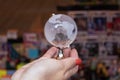 Close up to a glass earth globe over a female hand