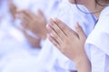 Close up to hand of girl making buddhist pray