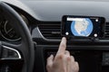 Close up to male driving and using navigation on the smartphone screen. Choose direction, globe on the screen