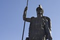 Close up to minerva goddess bronze sculpture with blue sky at background