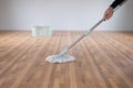 Close up to the mop, Housewife cleaning the floor.