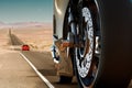 Close-up to a motorcycle in a road at the desert