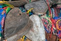 Close up to old wooden tags in heart shape hanging with many suspended chaotically intertwined colorful ropes tied into messy knot Royalty Free Stock Photo