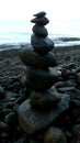 black rocks balancing in the beach Royalty Free Stock Photo
