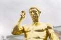 Close up to a roman baroque golden sculpture of peterhof palace