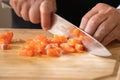 Close up to Slicing Cube Salmon by motion movement Knife by Prefessional Chef Royalty Free Stock Photo