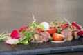 Close up to Spicy Thai Beef Salad garnished on top with cress and micro herb was put on a rectangular stone plate Royalty Free Stock Photo