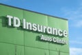 A close up to a TD insurance Auto Centre exterior building signage