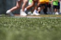 Close up to tennis shoes, kids running on grass Royalty Free Stock Photo