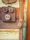 Close up to a very old light electric retro switch on on a wooden board. Vintage switch,