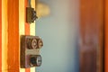 Close up to a very old light electric retro switch on on a wooden board. Vintage switch, Royalty Free Stock Photo