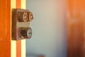 Close up to a very old light electric retro switch on on a wooden board. Vintage switch, Royalty Free Stock Photo