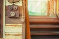 Close up to a very old light electric retro switch on on a wooden board. Vintage switch, Royalty Free Stock Photo