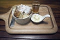 Close up toast in a cup with icing sugar powdered on top, honey in a mug shot, put on wooden plate,wooden table,morning breakfast Royalty Free Stock Photo