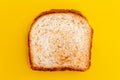Close up. Toasted bread on yellow background.