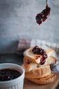 Close-up of toasted slices of bread with homemade strawberry jam drippin from spoon Royalty Free Stock Photo