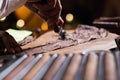 Close-up of a tobacco making process