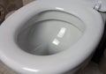 Close-up of toilet bowl. White toilet in the bathroom Royalty Free Stock Photo