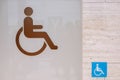 Close up of toilet door with disable sign Royalty Free Stock Photo