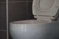 Close-up toilet flushing, white, clean in the bathroom. The picture has some clarity Royalty Free Stock Photo