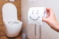 close-up of toilet paper with drawn happy face, concept of health, hygiene Royalty Free Stock Photo