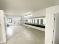 Toilet room for boys with urinals sinks and mirrors on high school Royalty Free Stock Photo