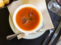 Close-up of tomato gazpacho soup in bowl topped with ice cubes Royalty Free Stock Photo